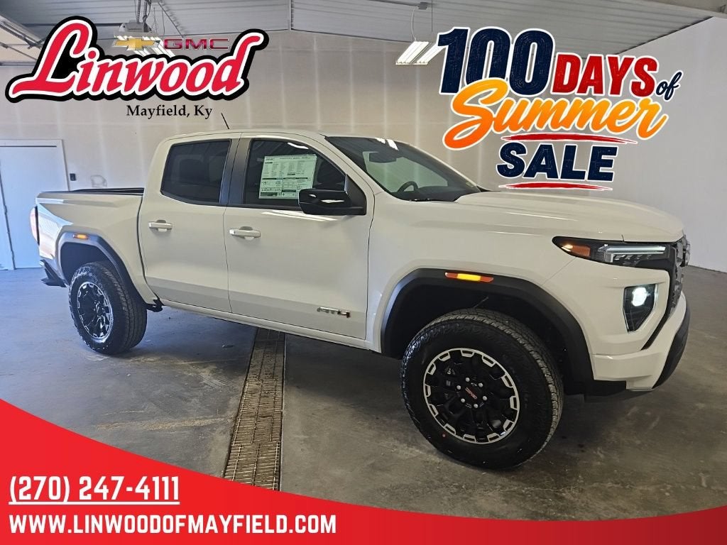 2026 GMC Canyon AT4 in Summit White — front three-quarter view