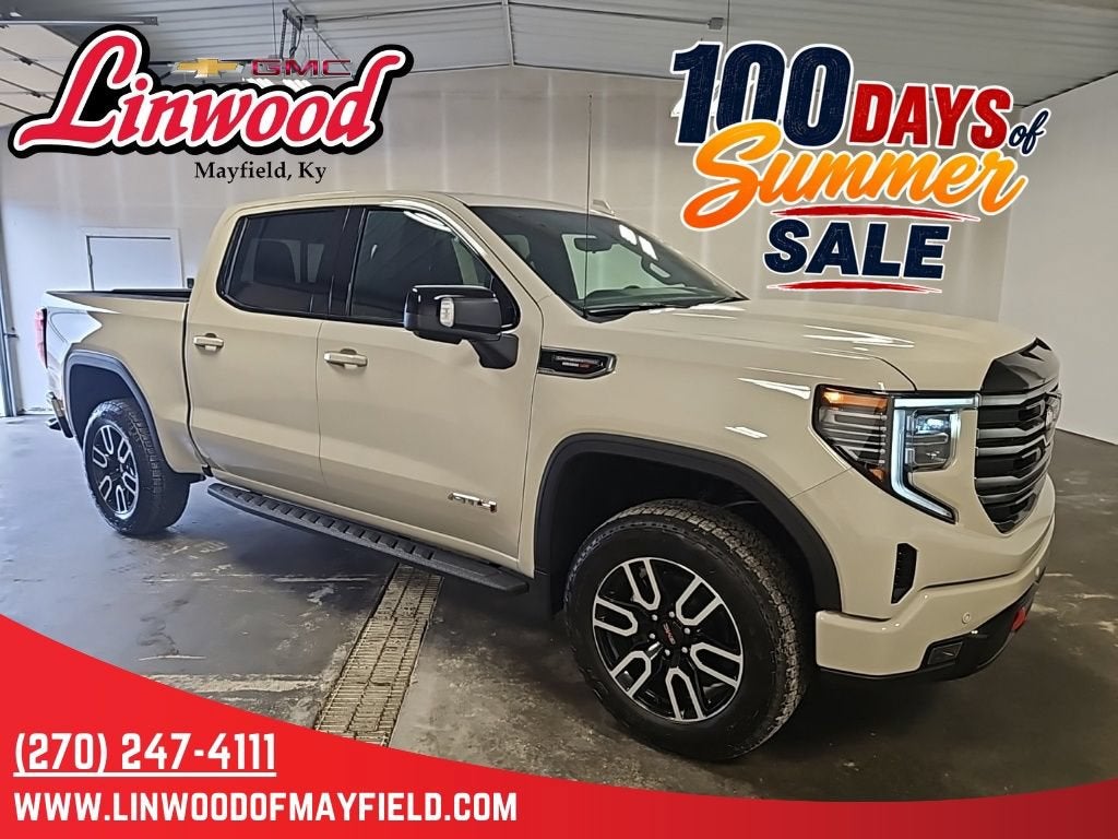 2026 GMC Sierra 1500 AT4 in Coastal Dune — front three-quarter view